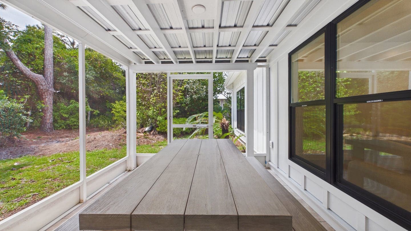 Screened porch with outdoor table